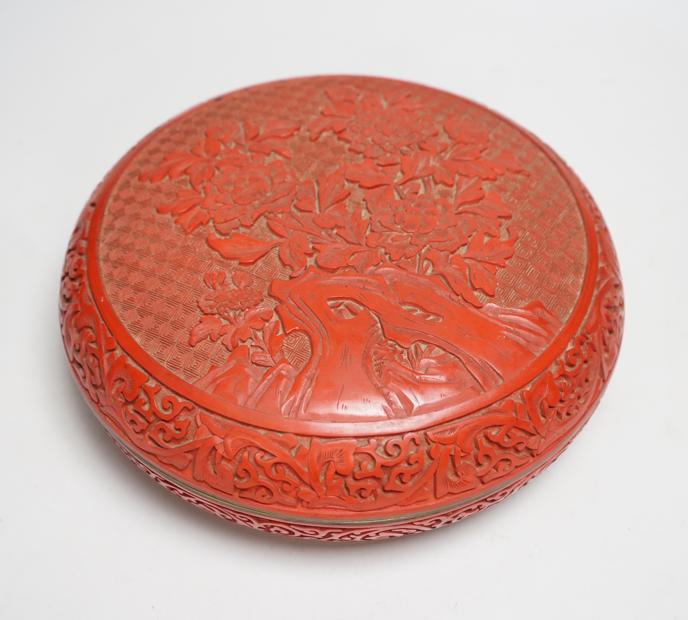 A 20th century Chinese cinnabar lacquer circular box, 25.5cm diameter